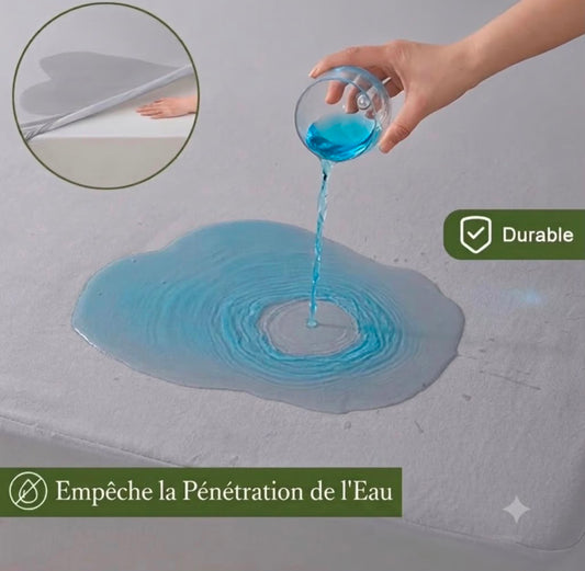 Protège-matelas imperméable 360° gris clair posé sur un lit